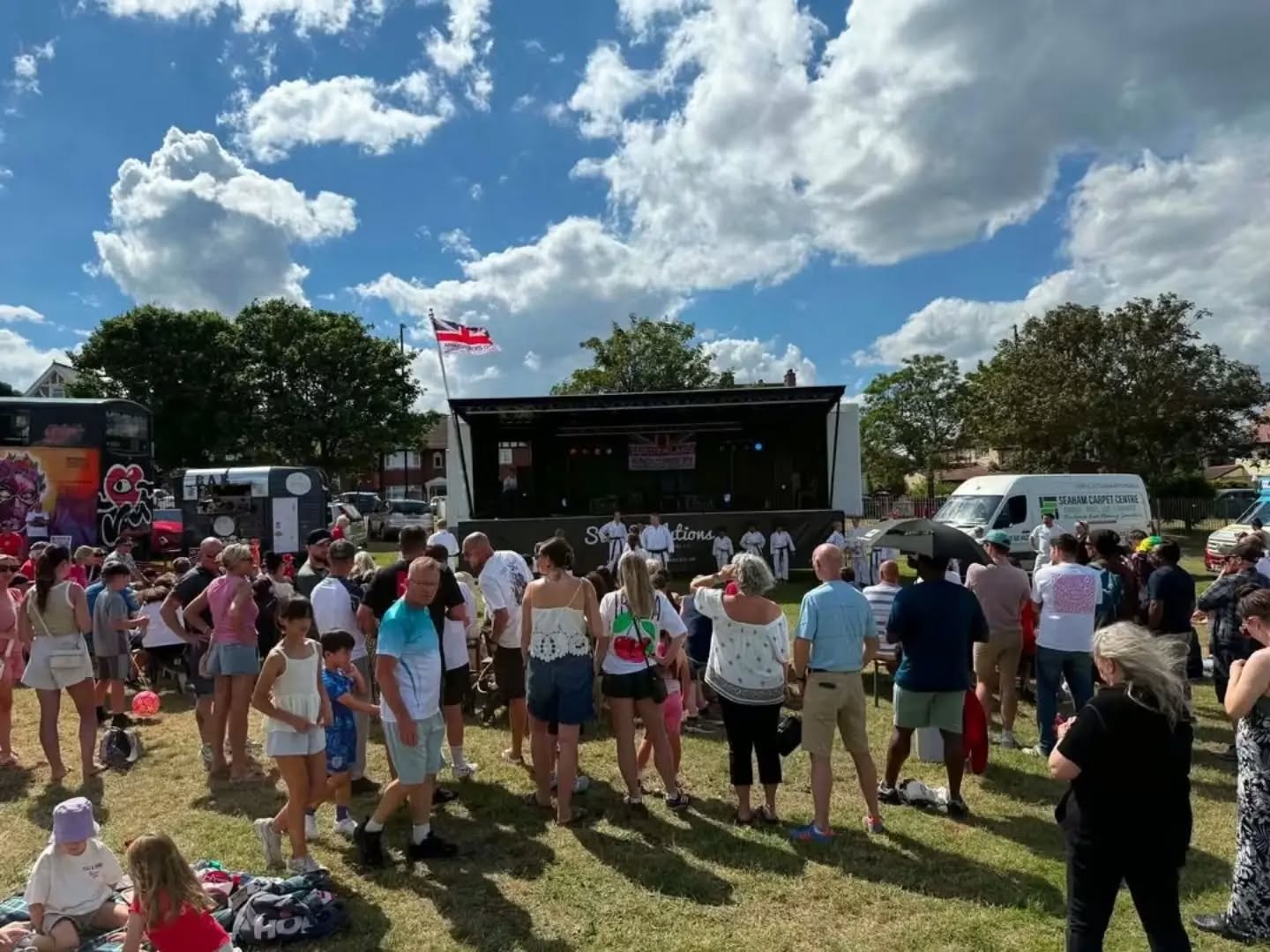 Crowd gathered at a sunny public event