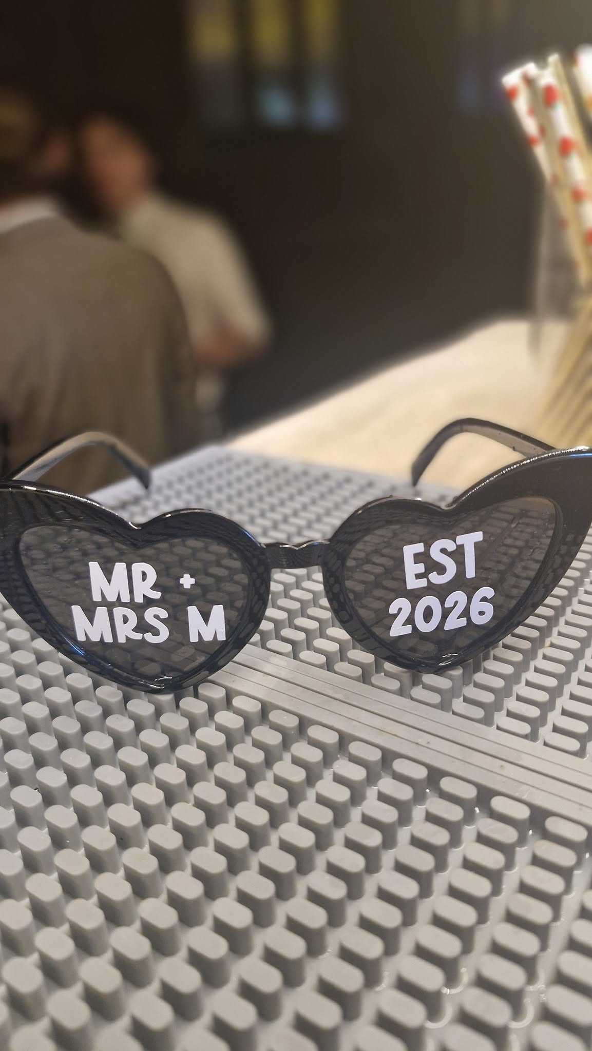 Personalised wedding sunglasses on the bar